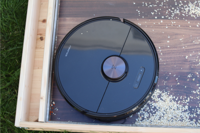 Roborock S6 vacuums along a skirting on a hard floor